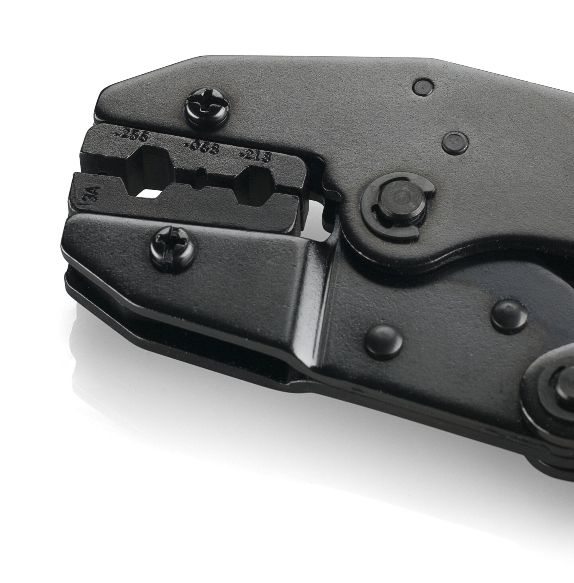 Close-up of Presseværktøj til koaksialforbindelser, a black metal crimping tool with visible screw heads and wire gauge markings, ideal for coaxial connections, isolated on a white background.