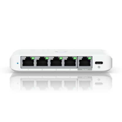 Ubiquiti Switch Flex Mini 2,5G 5P netværksswitch hvid med fem Ethernet-porte, grønne indikatorer og USB-C-port til højre.