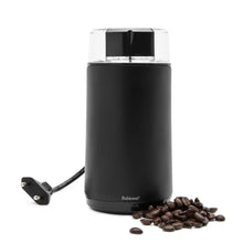 Rubicson kaffe- og krydderimølle i sort rustfrit stål med transparent låg og ledning ved siden af hele kaffebønner.