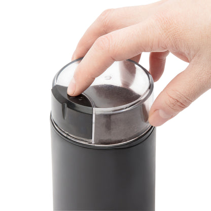 Rubicson kaffe- og kryddemølle sort, transparent låg, hånd trykker på topknap, egnet til kaffebønner og krydderier.