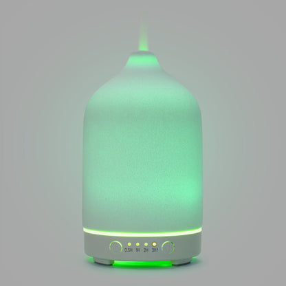 Aromadiffusor med ultralyd i mat grøn, dampudgang i toppen, brandtimer-knapper (0,5H, 1H, 2H, 3H) med indikatorlys.