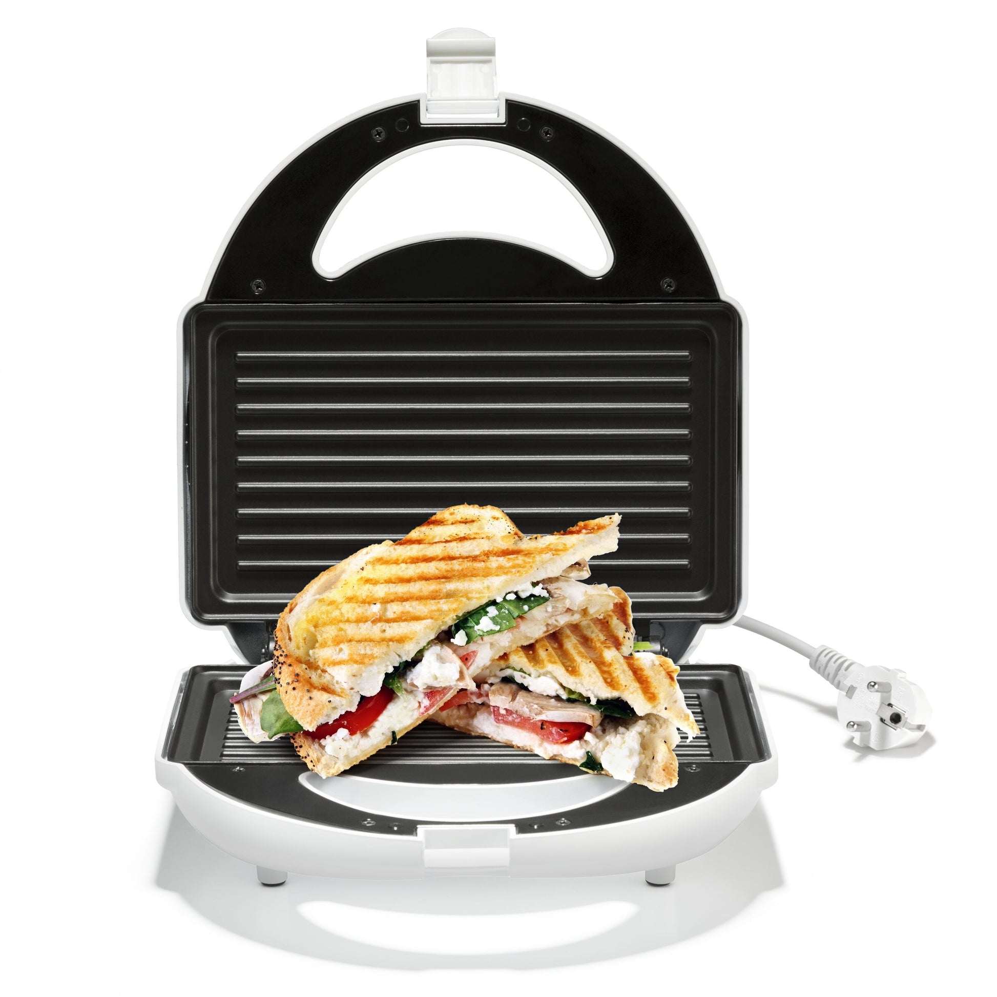 Rubicson Smørrebrødsgrill med non-stick belægning, el-ledning synlig, indeholder halveret sandwich med tomat, spinat og ost.