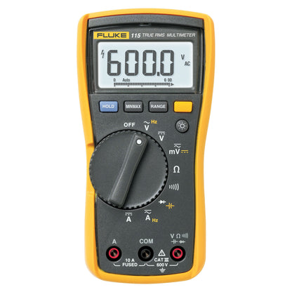 Fluke 115 gul multimeter, True RMS digital, display viser 600,0 volt AC, roterende drejehjul, flere knapper, stik i bunden.