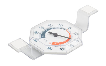 Vinduestermometer i plast, transparent med hvid skive, sort viser og Celsius-tal til montering på vindue eller overflade.