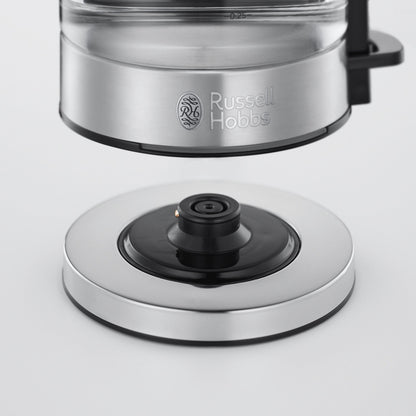 Russell Hobbs Compact Home kedel med synligt forbindelsespunkt på rund metal-sort base og Russell Hobbs-logo på kedlen.