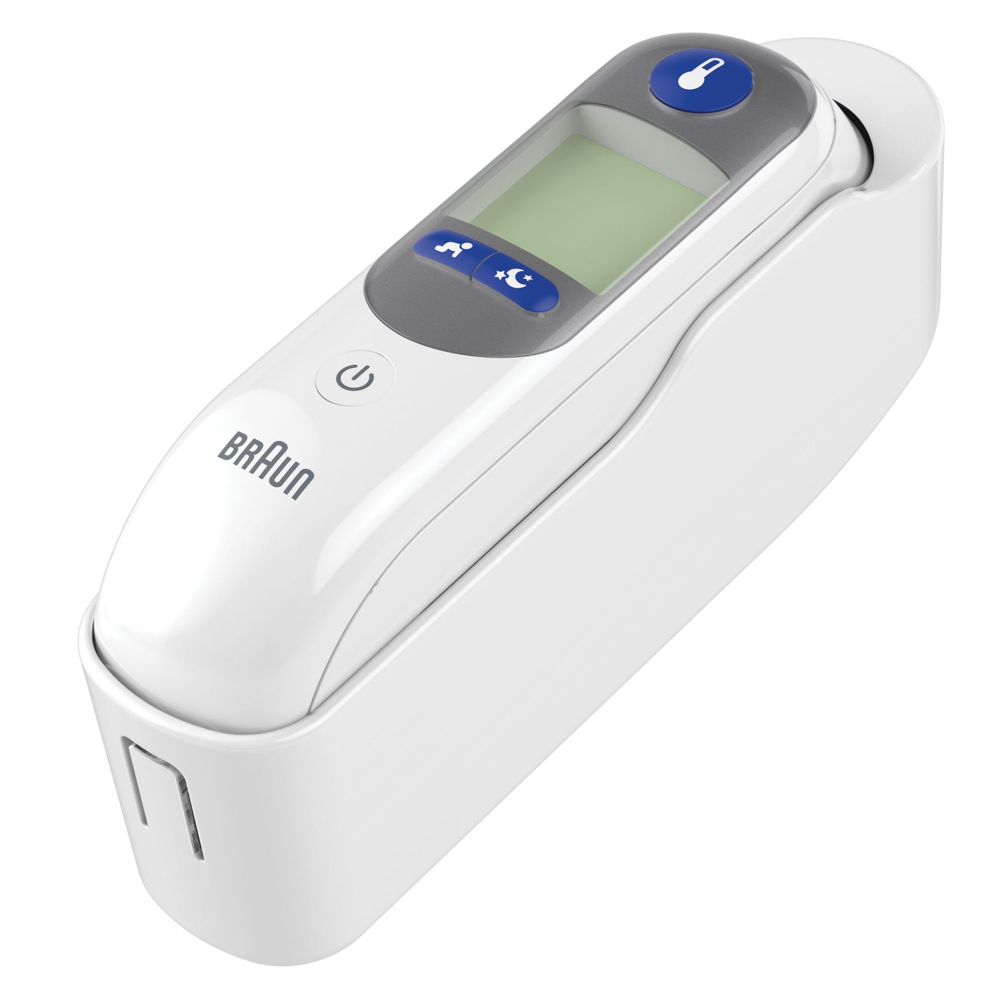 Braun Thermoscan 7+ øretermometer i hvid ladestation med LCD-skærm, tænd/sluk-knap og blå termometerknap.