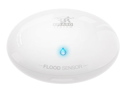 Fibaro Z-wave vanddetektor rund hvid med blåt dråbeikon til vandlækage og oversvømmelsesdetektion.