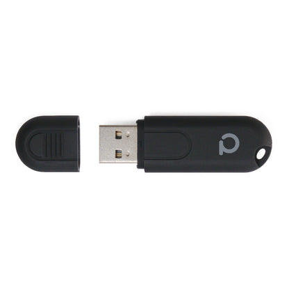 Conbee II Zigbee USB controller sort med aftaget hætte, synlig metalstik, rundt logo på kroppen.