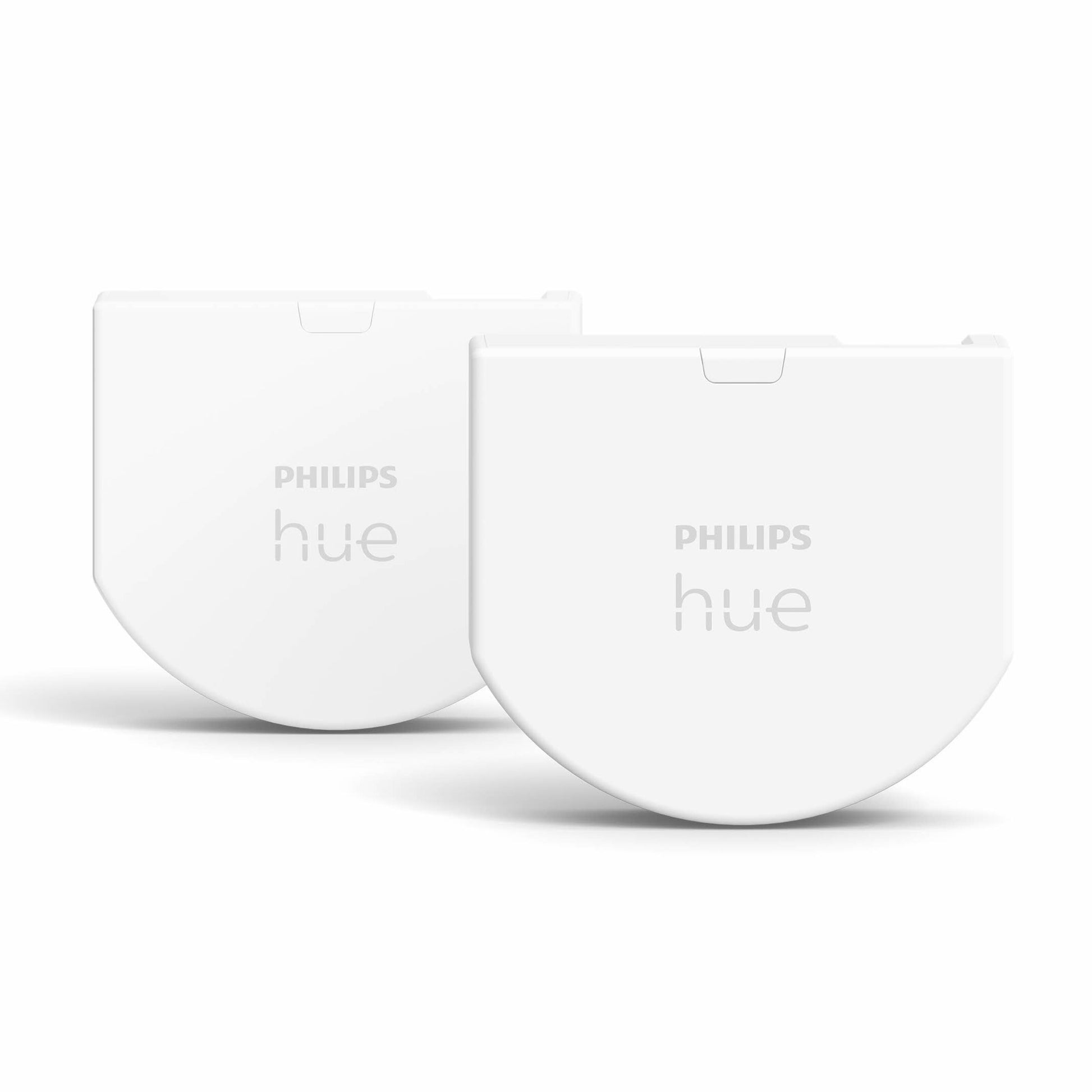 Philips Hue Vægafbrydermodul 2 stk, hvide halvmåneformede kontakter med "PHILIPS hue"-logo.