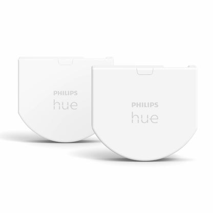 Philips Hue Vægafbrydermodul 2 stk, hvide halvmåneformede kontakter med "PHILIPS hue"-logo.