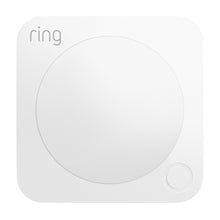 Ring Alarm Bevægelsesdetektor hvid, kvadratisk med afrundede kanter, stor central cirkel, lille knap nederst til højre, ring-logo øverst.
