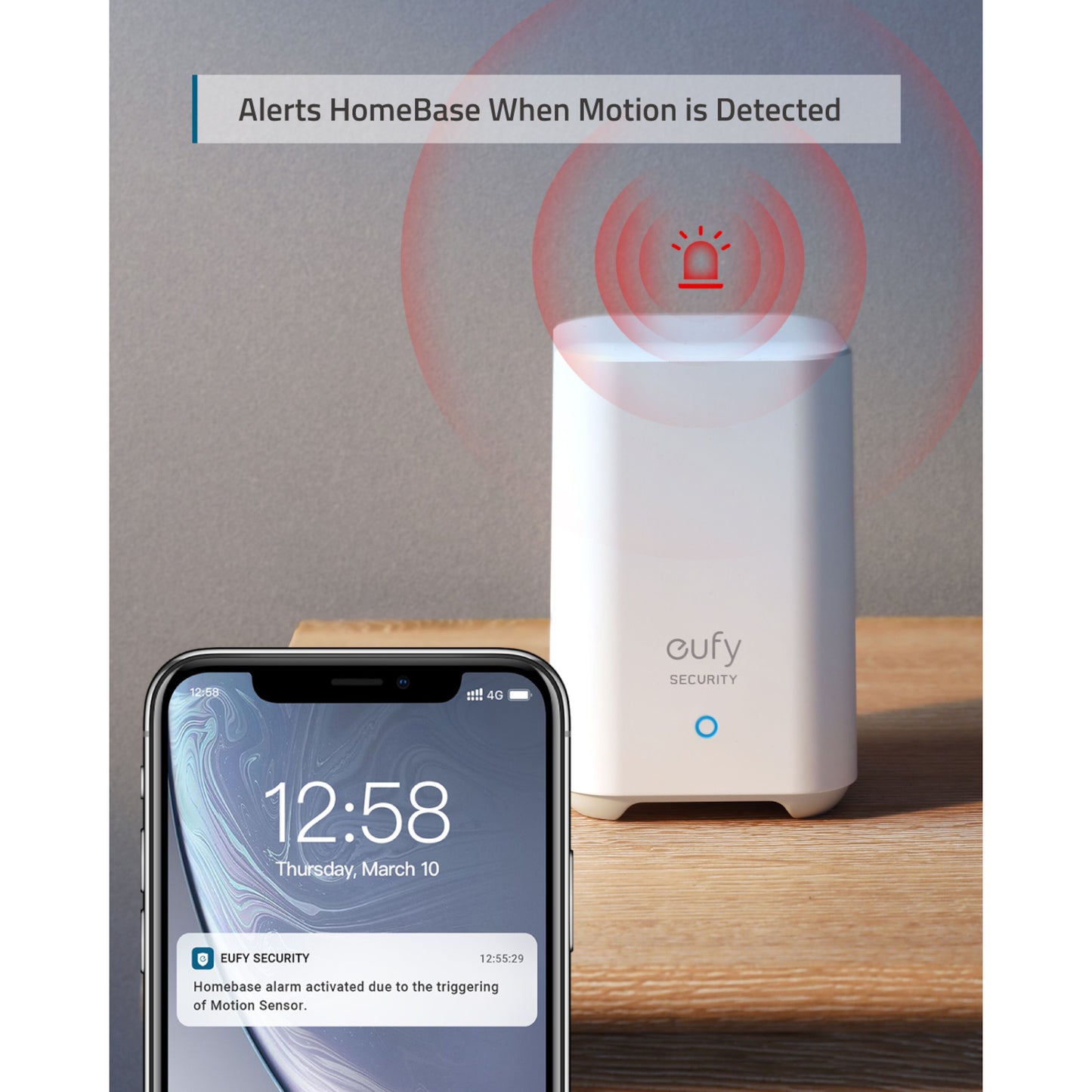 Eufy Sikkerhedsbevægelsessensor viser notifikation på smartphone, hvid Eufy HomeBase med røde alarmer, træbaggrund.