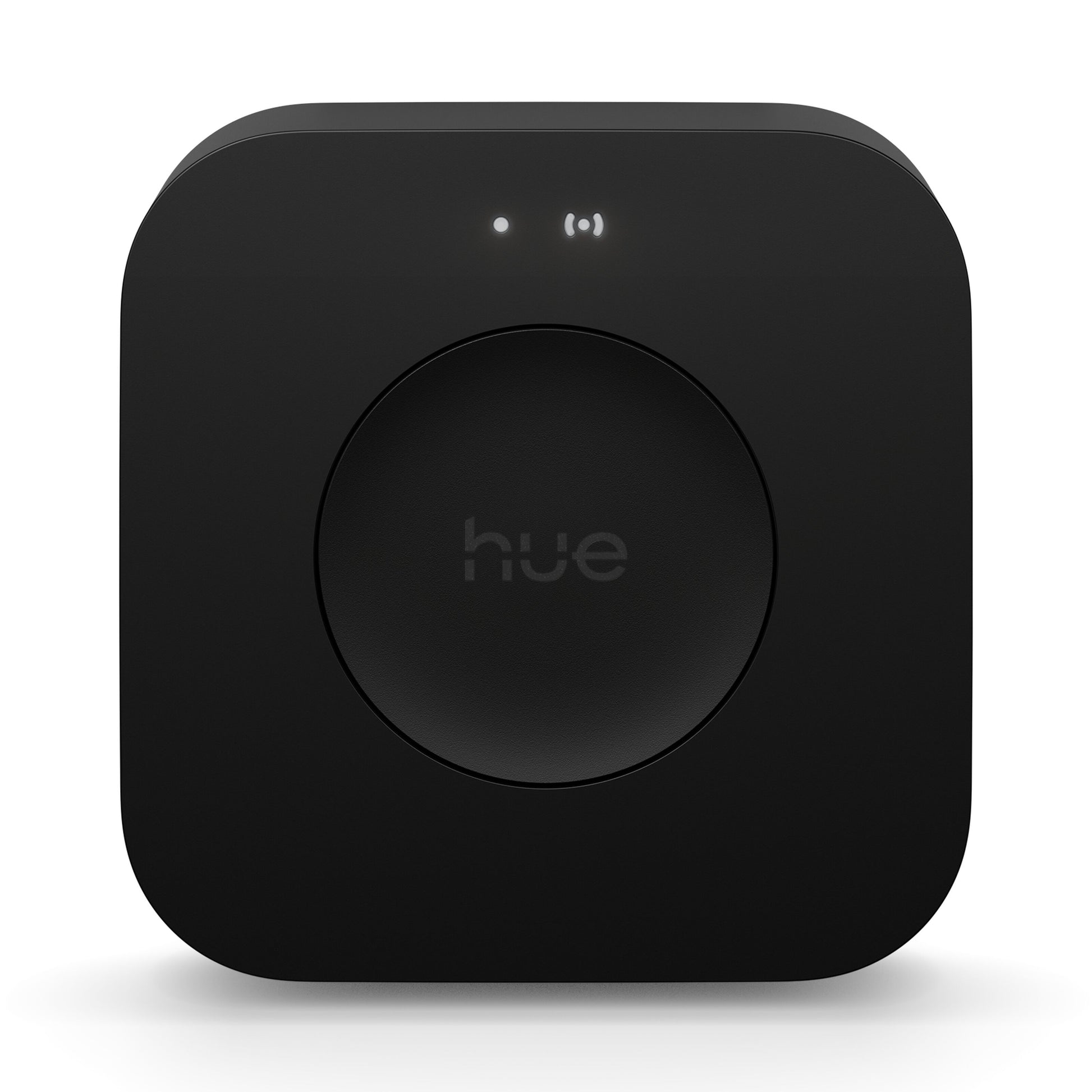 Philips Hue Bridge Pro Broen smart hub sort med afrundede hjørner, rund knap i midten og to små indikatorlys.