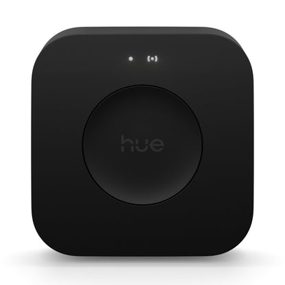 Philips Hue Bridge Pro Broen smart hub sort med afrundede hjørner, rund knap i midten og to små indikatorlys.
