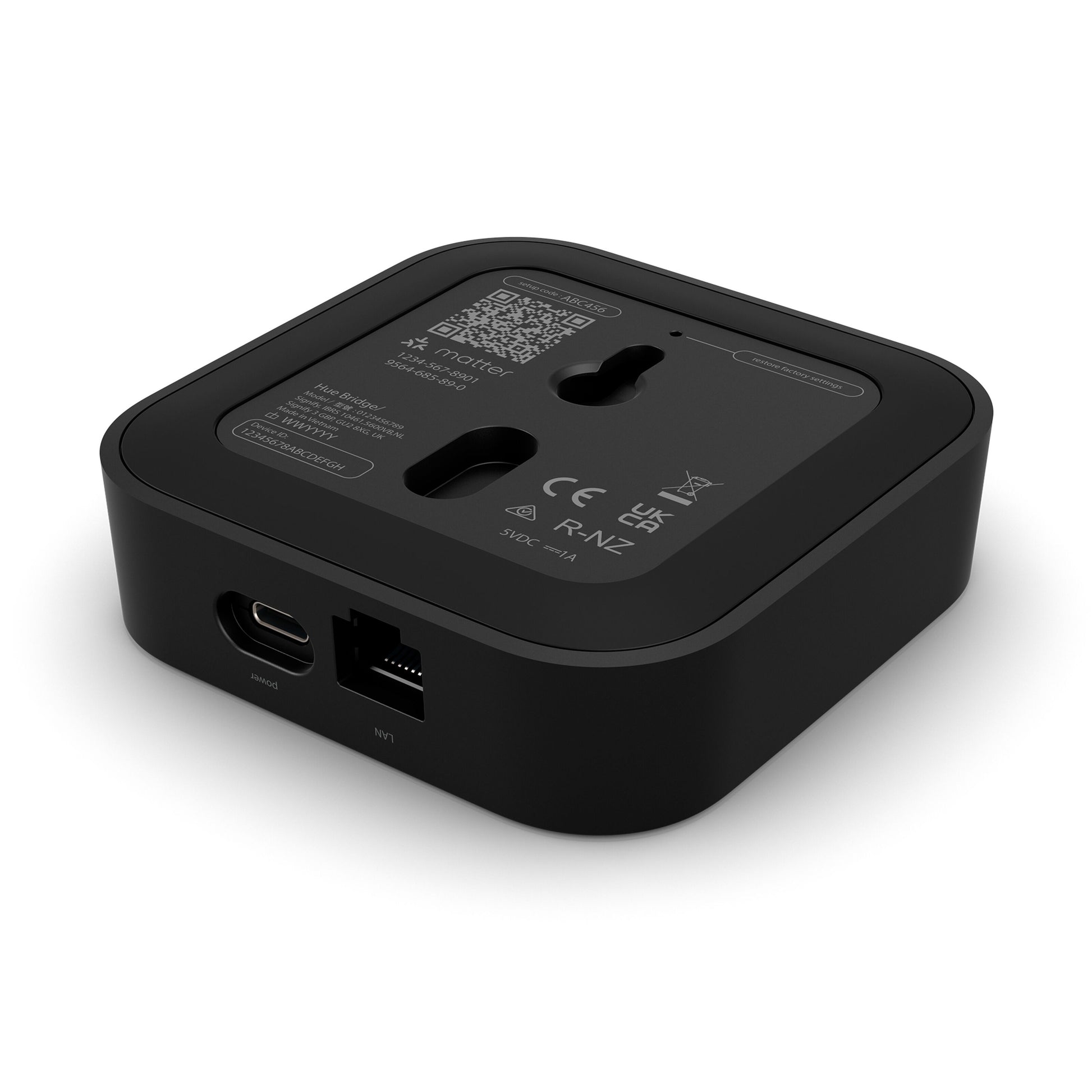 Philips Hue Bridge Pro Broen, sort firkantet hub med afrundede kanter, USB-C og Ethernet port, QR-kode og labels.