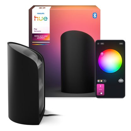 Philips Hue Spil Wall Washer vægbelysning sort med tilhørende æske og smartphone med farvehjuls-app.