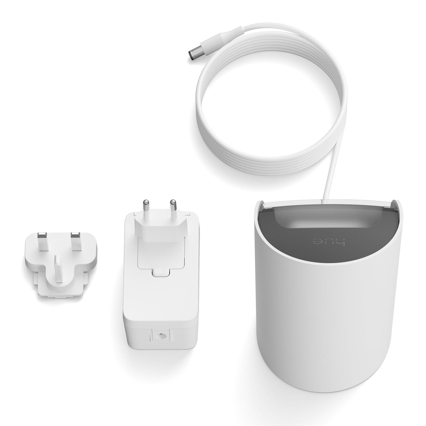 Philips Hue Spil Wall Washer væglampe, hvid cylinder med gråt topstykke samt strømadapter, flad hvid ledning og stik.
