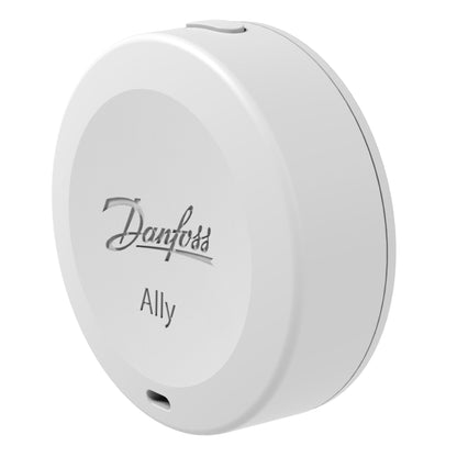Danfoss Ally temperatur- og fugtsensor hvid, cirkulær, topknap, micro USB-port nederst, måler temperatur og luftfugtighed.