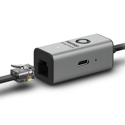 Athom Hjemmeenergi-dongle grå, Ethernet-port, USB-C-port, LED-indikator, Ethernet-kabel delvist tilsluttet.