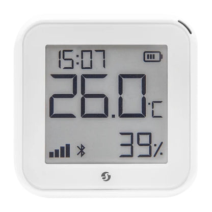 Shelly HT Gen 3 termometer og hygrometer hvid, kvadratisk LCD-display med tid, temperatur, luftfugtighed, batteri og signal.