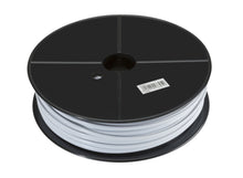 Modulkabel hvid 4 ledere på stor sort plastspole set oppefra med centreret hul, sidehul og stregkode på toppen.