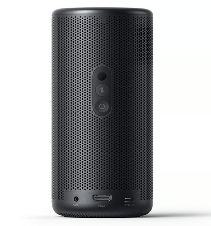 Nebula Capsule 3 Laser-miniprojektor, sort cylinder, perforeret overflade, tre knapper på bagsiden, AUX/HDMI/Type-C-porte.
