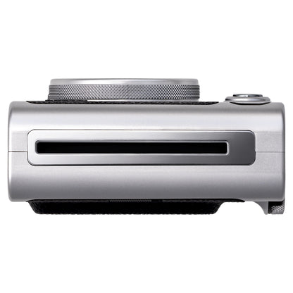 Fujifilm Instax Mini Evo Sort instant kamera set oppefra med objektiv, kontrolhjul og udløserknap, metallic finish.