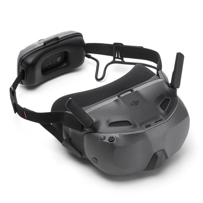 DJI Neo Motion Fly More Combo med FPV-briller mørkegrå, justerbar hovedrem, skumpude, antenne og batteripakke.