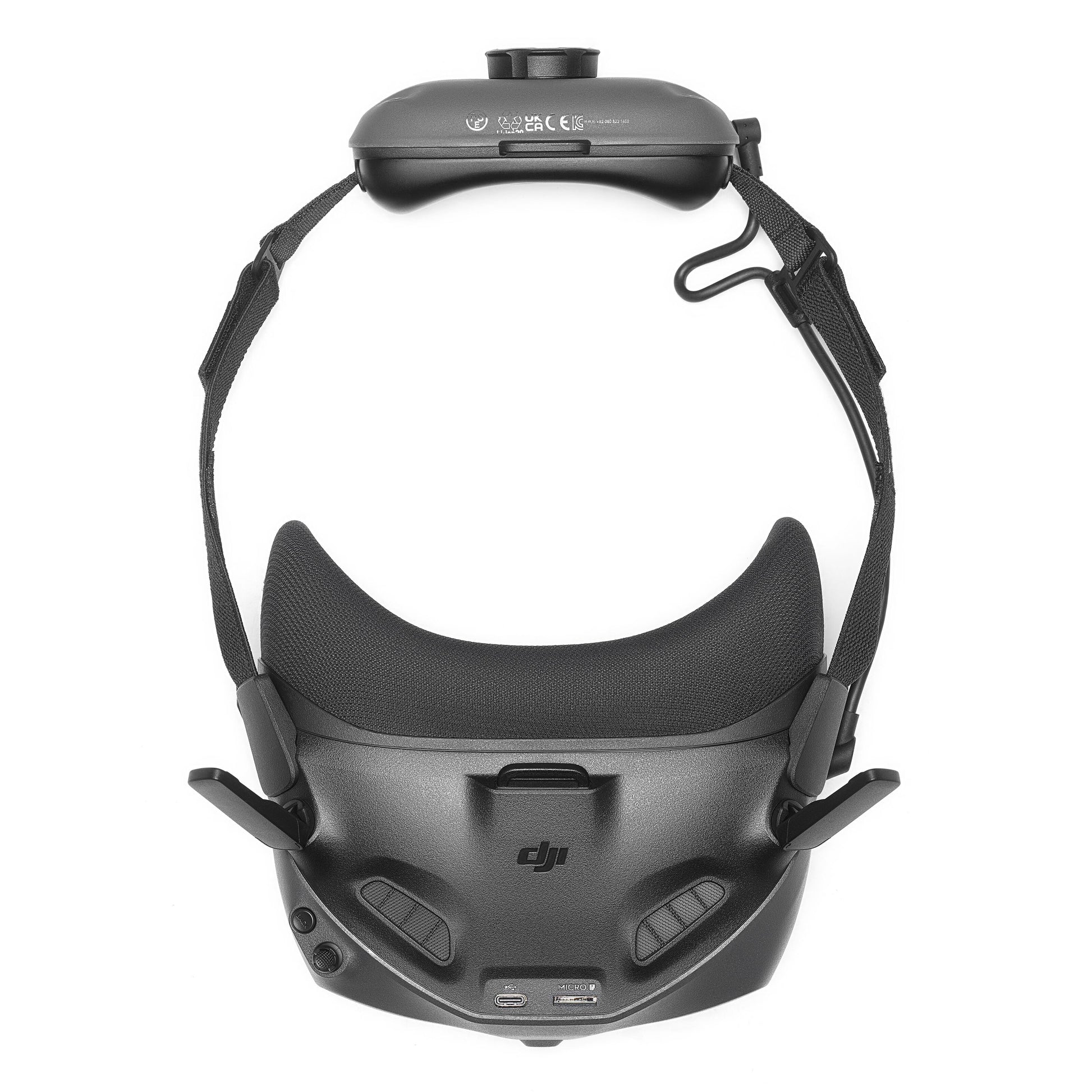 DJI Neo Motion Fly More Combo sort FPV-headset med justerbare stropper, kontrolknapper og porte til droneflyvning.