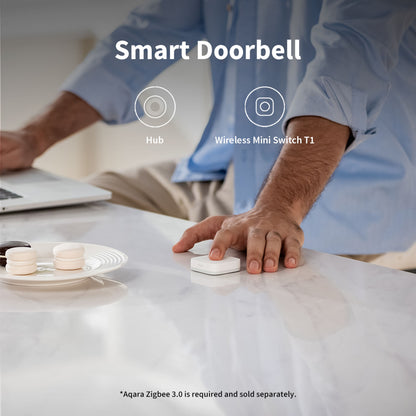 Aqara T1 Mini Trådløs Switch på marmorbord med Smart Doorbell-label, Hub- og Wireless Mini Switch T1-ikoner synlige.