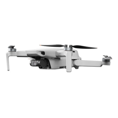 DJI Mini 4K Fly More Combo grå drone med frontkamera, fire propellerarme og 4K videooptagelse.