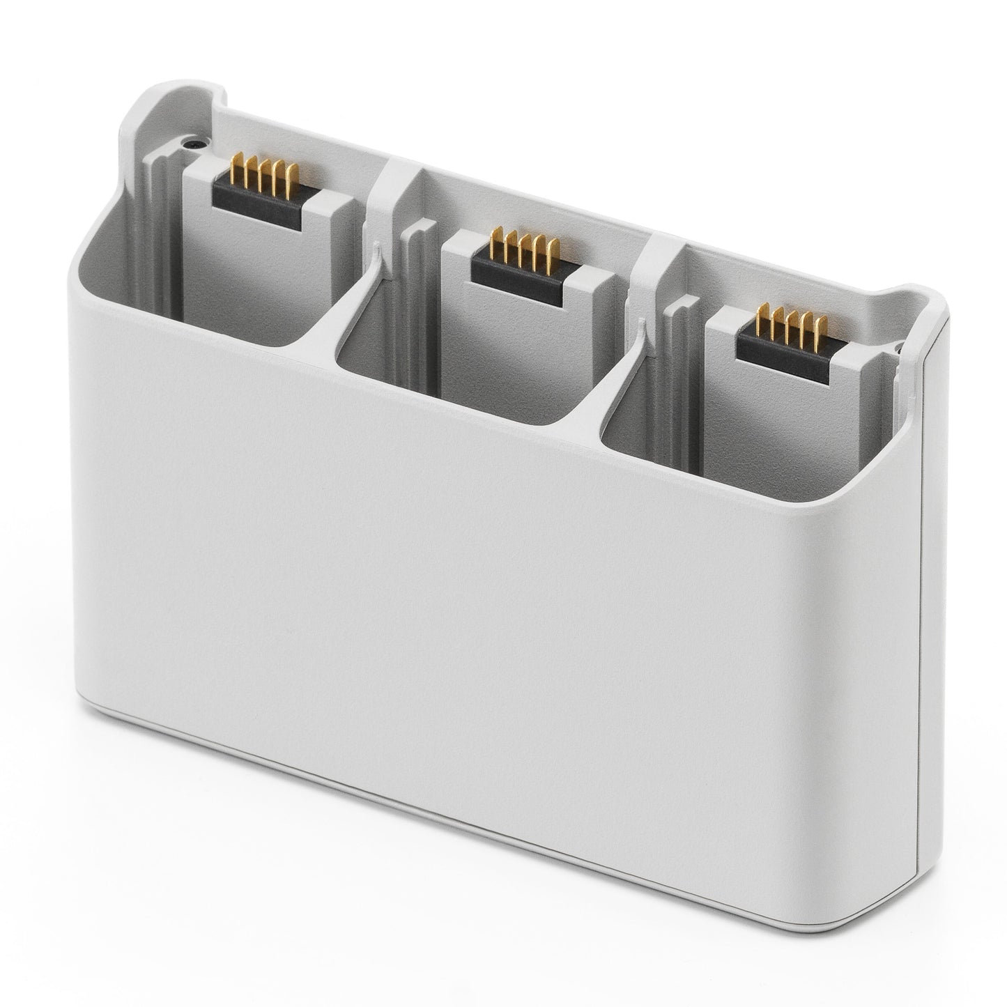 DJI Neo opladningsstation, lys grå, tre slots til små rektangulære batterier, guldstik.