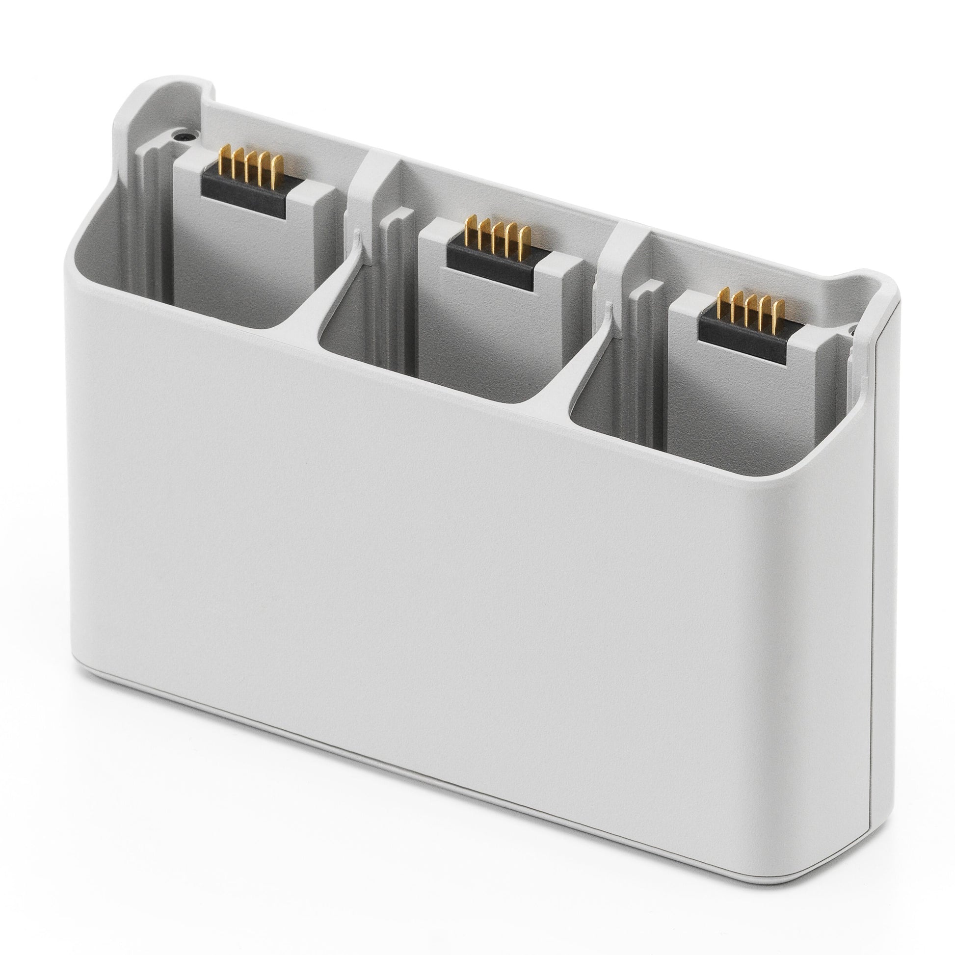 DJI Neo opladningsstation, lys grå, tre slots til små rektangulære batterier, guldstik.
