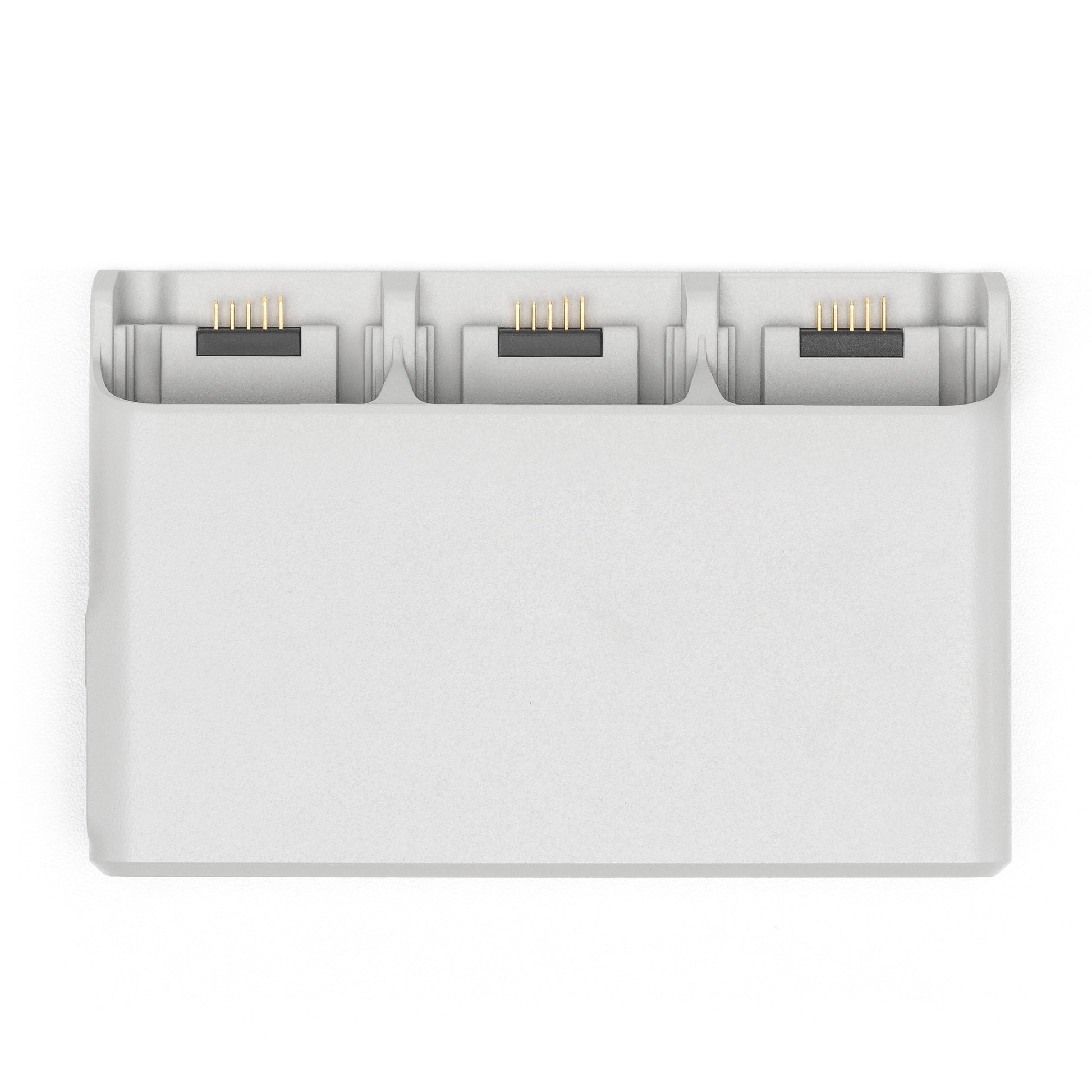 DJI Neo opladningsstation med tre slots og guldkontakter til DJI Neo-batterier.