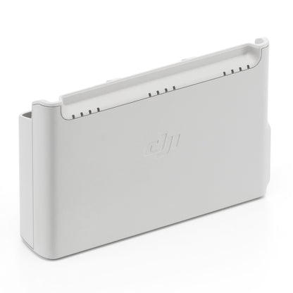 DJI Neo hvid opladningsstation til batterier, opretstående med afrundede kanter, DJI-logo foran, porte øverst.