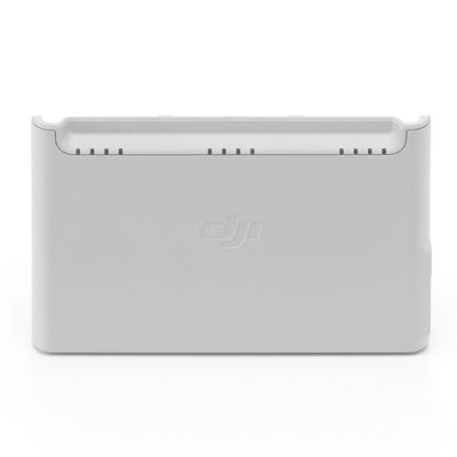 DJI Neo opladningsstation til batterier, hvid, rektangulær, diskret DJI-logo.