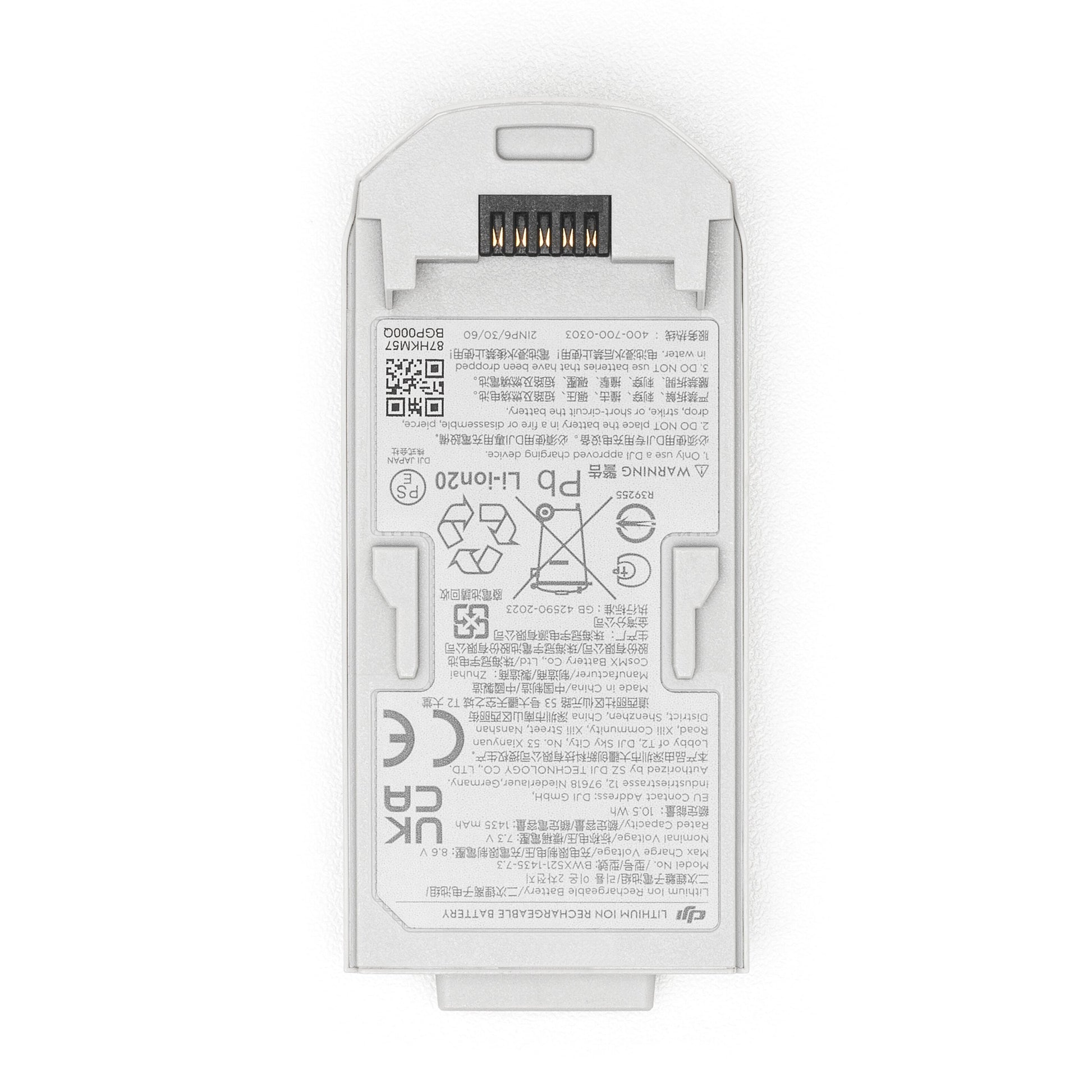DJI Neo gråt rektangulært dronebatteri sæt oppefra med tekniske specifikationer, advarsler og certifikater på label.