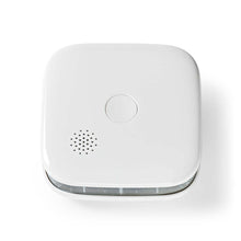 Nedis SmartLife røgalarm hvid, afrundet firkant, Wi-Fi, testknap i midten, højttalergitter og bundventilation.