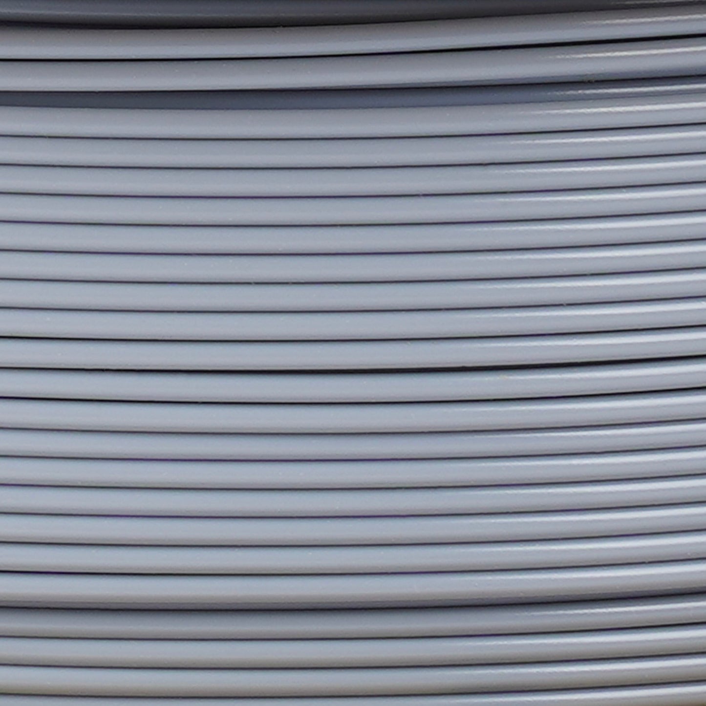 Copymaster3D PLA-filament 1,75 mm grå til 3D-printer stablet parallelt, synlige horisontale linjer.