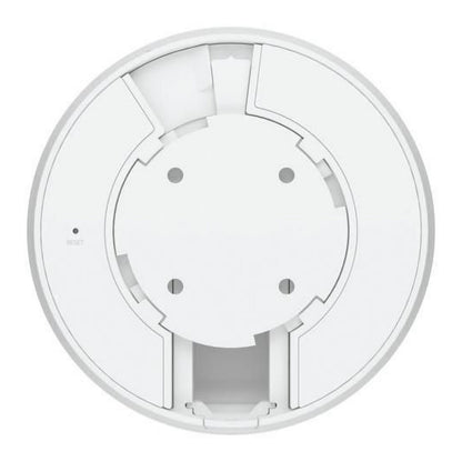 Ubiquiti G5 Dome PoE-overvågningskamera set oppefra med centralt cirkulært design, fire huller og flere kant-slidser.