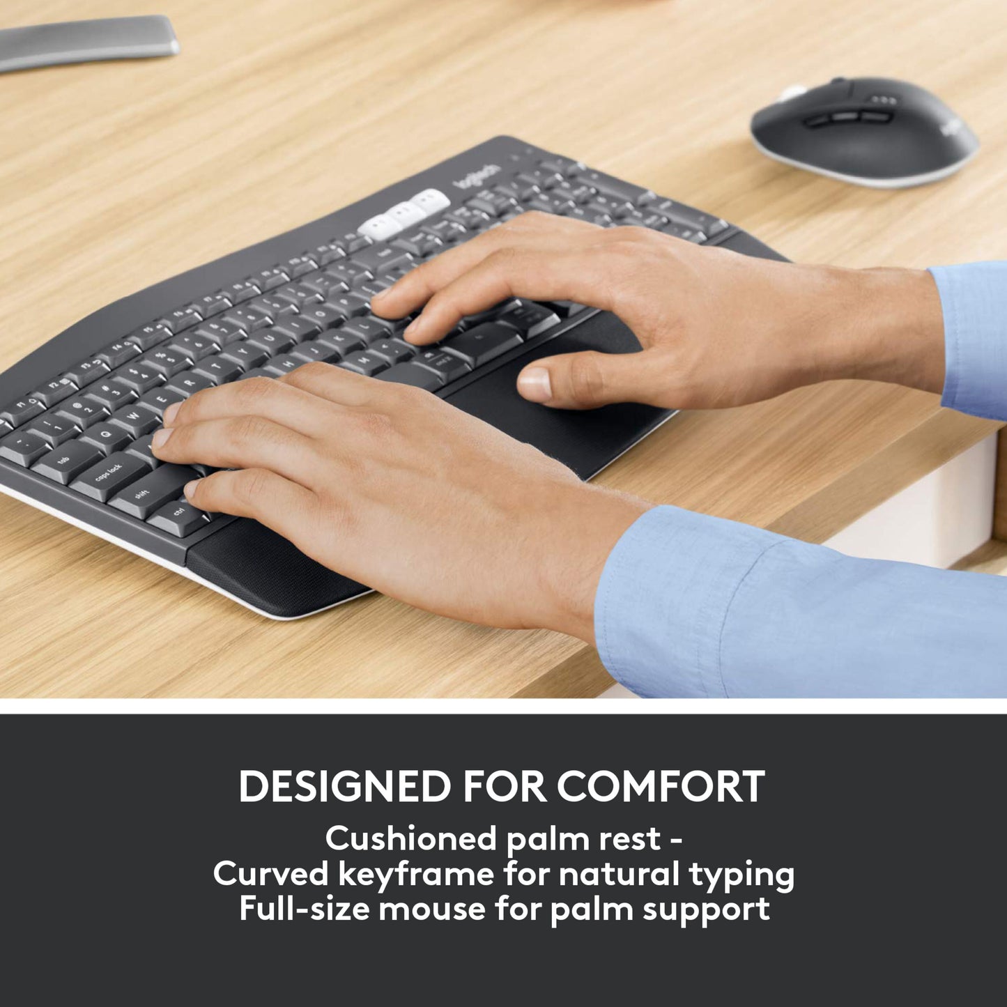 Logitech MK850 trådløst tastatur og mus, flot design, hånd hviler på ergonomisk mus, træskrivebord.