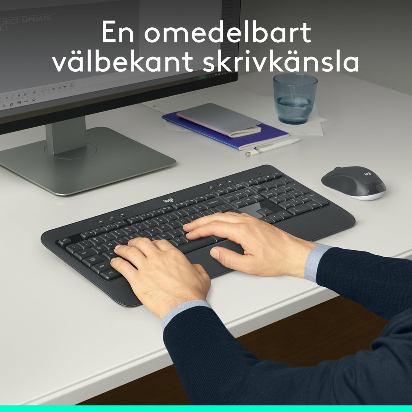 Logitech MK540 sort trådløst tastatur og mus med ergonomisk håndledsstøtte, mus ved siden af, skærm med svensk tekst.