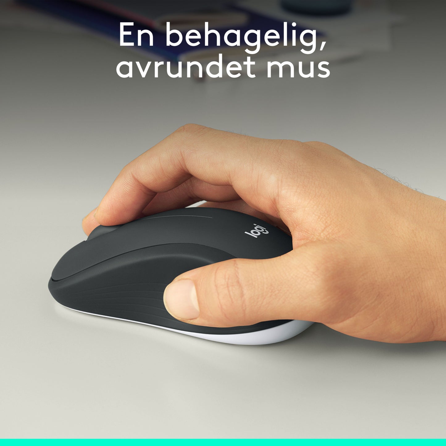 Logitech MK540 trådløst tastatur og mus, hånd på tastatur, norsk tekst: "En behagelig, avrundet mus.