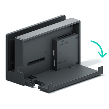 Nintendo Switch Dockingsstation sort med åben bagklap, synlige labels til AC Adapter, USB-dock og HDMI-port, pil viser åbning.