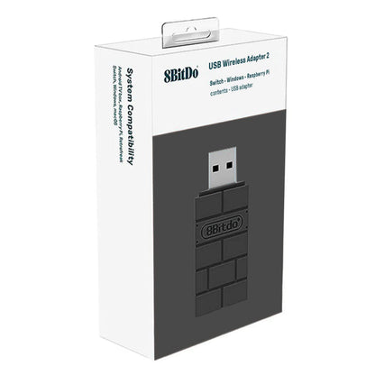 8Bitdo Trådløs USB-adapter 2 sort, kompatibel med Nintendo Switch, Windows og Raspberry Pi på produktæske.