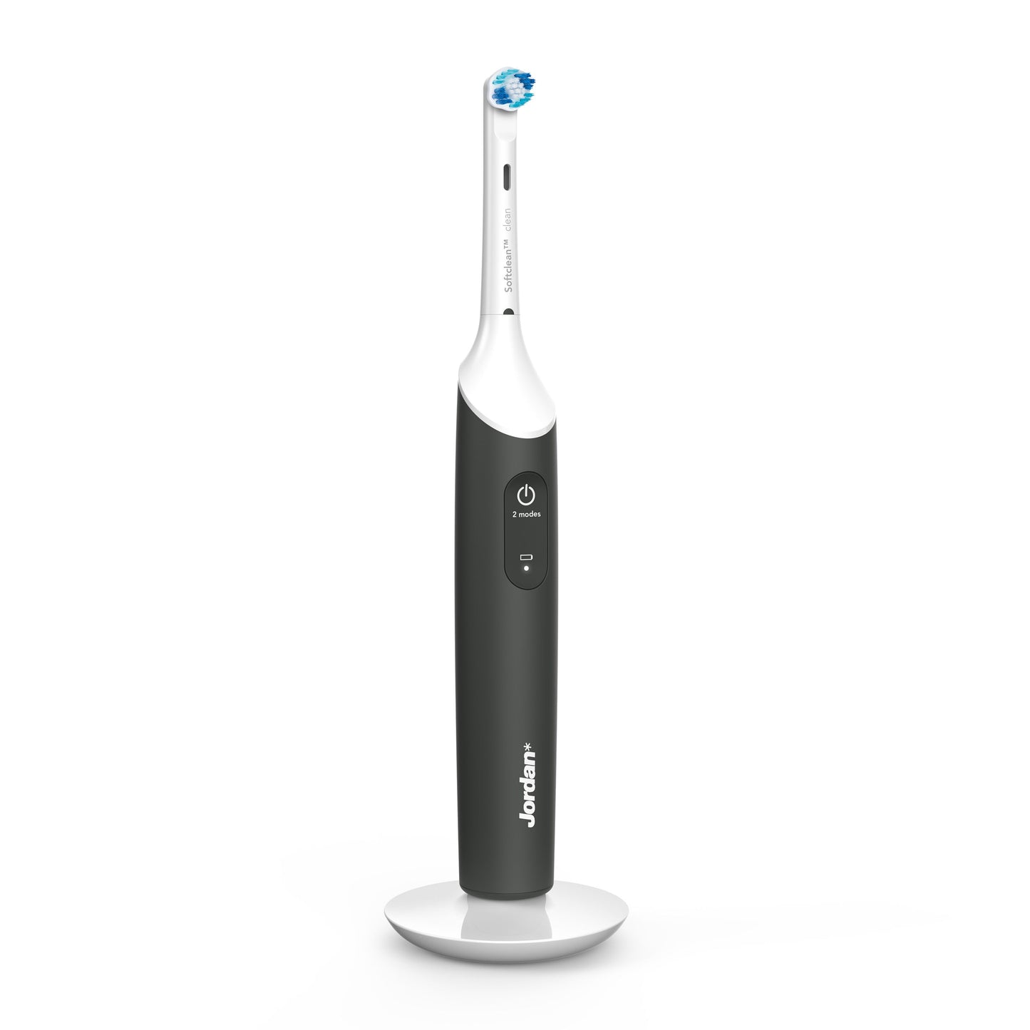 Jordan Clean Smile Plus elektrisk tandbørste sort/hvid, synlig power-knap og rund børstehoved på hvid opladerbase.