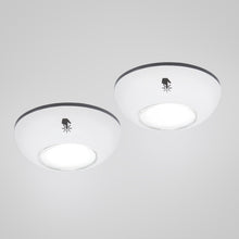 Rubicson Touch LED-spot 2-pak, rund og hvid, med klokke-med-stråler-symbol, begge lamper tændt.
