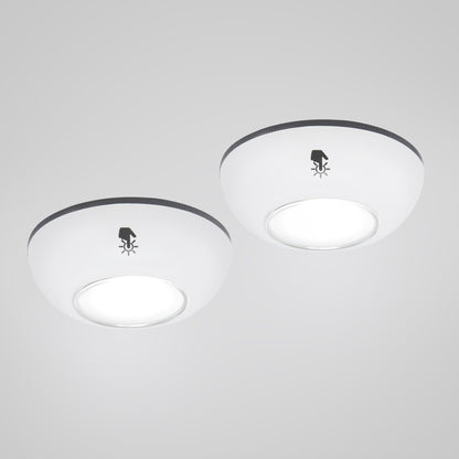 Rubicson Touch LED-spot 2-pak, rund og hvid, med klokke-med-stråler-symbol, begge lamper tændt.
