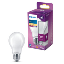 Philips LED pære E27 7W 806lm 2700K varmt hvidt lys ved siden af lilla/hvid æske med energispareikon.