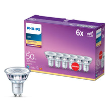 Philips LED-pære GU10 355 lm spotlys 6-pak varm hvid, synlige pærer foran lilla og orange Philips-æske.